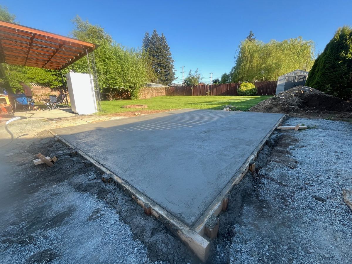 Freshly poured concrete slab for an outbuilding